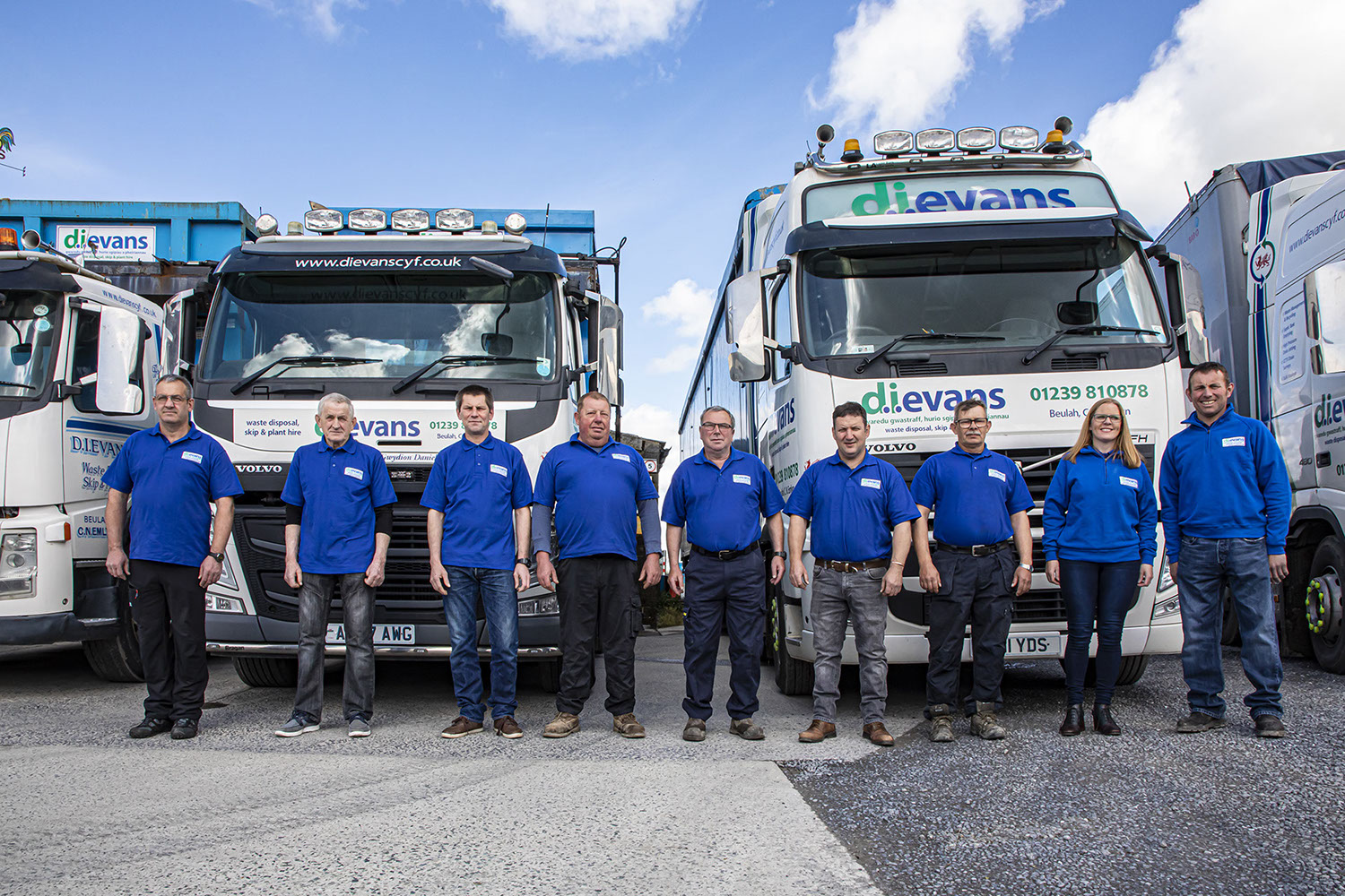 D.I. Evans Staff infront of Trucks.