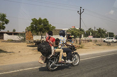 Family of four travelling by motorbike, India