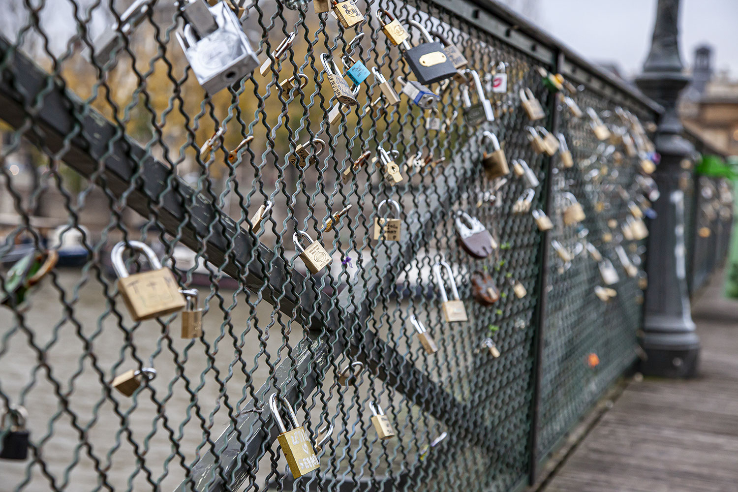 Bridge over River Seine in Paris with locks fixed there by lovers.