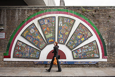 London, Street Art with Kate walking past.
